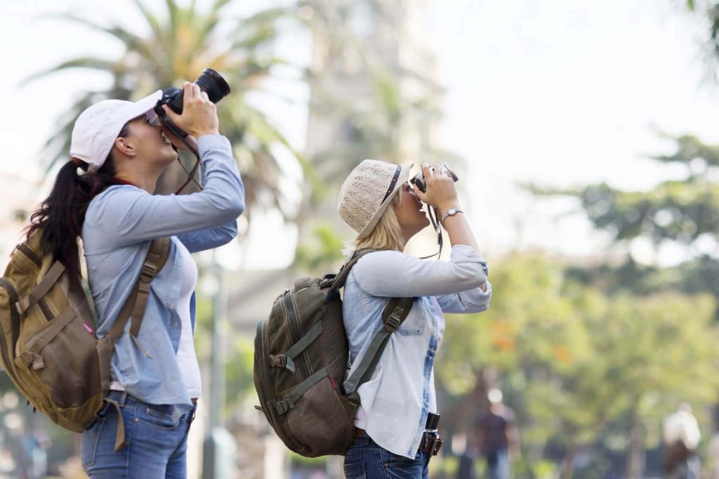 Shallow depth of field photo of tourists taking photographs.